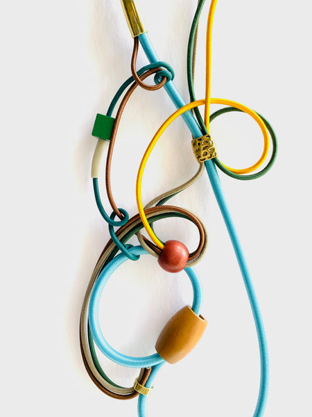 Once Made Necklace: Connecting Necklace in Light Blue, Brown Green and Gold