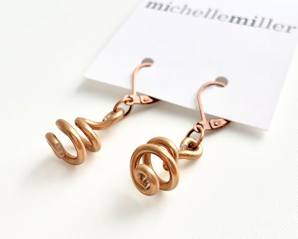 These Loopt earrings are super light weight and hang about 2cm long. They are made of aluminum wire.