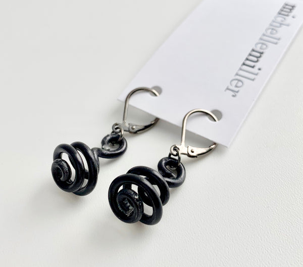 These Loopt earrings are super light weight and hang about 2cm long. They are made of aluminum wire.