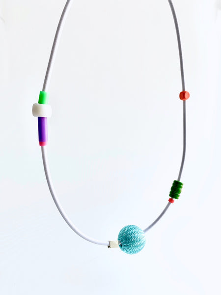 This piece is made on 3mm shock ord and has an interlocking magnetic clasp. It is 56 cm in length.