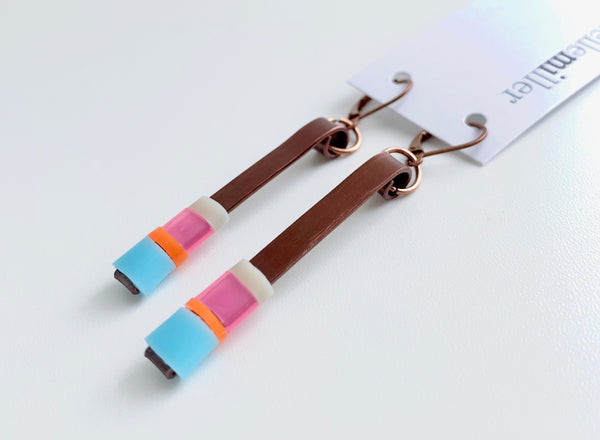 Matchstick earrings in bronze coloured aluminum wire with light blue, pink, beige and orange coloured silicone tubing. These hang 4.5cm in length.