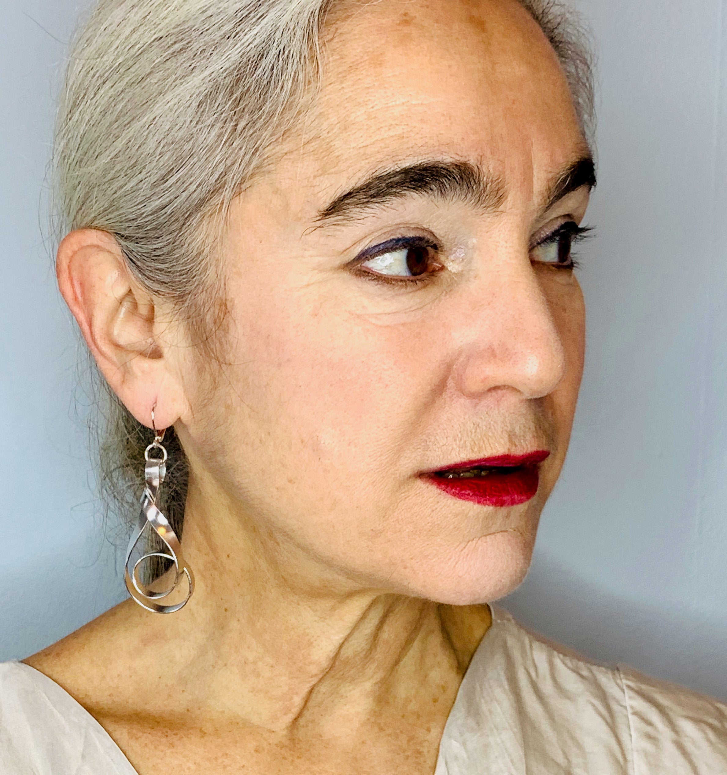 A woman wearing beautiful earrings