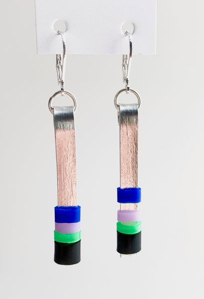 Matchstick earrings in silver coloured aluminum wire with black, royal blue, lavender and green coloured silicone tubing. These hang 4.5cm in length.