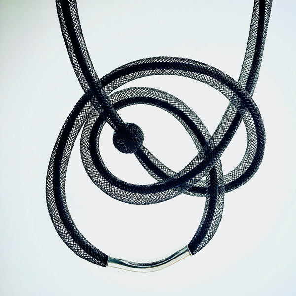 This Tubular is made with black shock cord and black netted tubing. it is 115cm