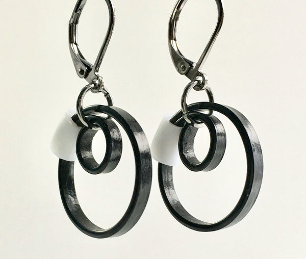 These Reel earrings with a white accent are a simple fairly small earring that hangs 2cm long.