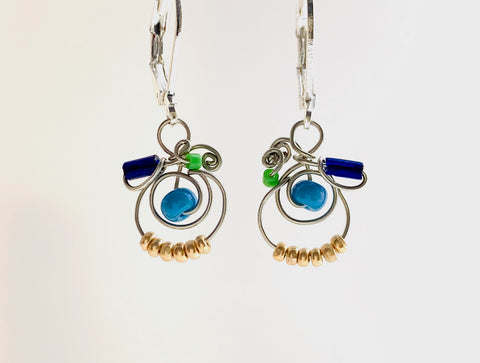 Classic MiMi earrings in silver coated copper wire with blue, green and gold glass beads.