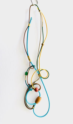 Once Made Necklace: Connecting Necklace in Light Blue, Brown Green and Gold