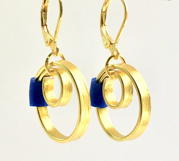 These Reel Earrings are made of gold coloured aluminum wire with added royal silicone beads. They hang about 2cm in length. All Earrings sport non nickel leverback hooks unless noted otherwise.