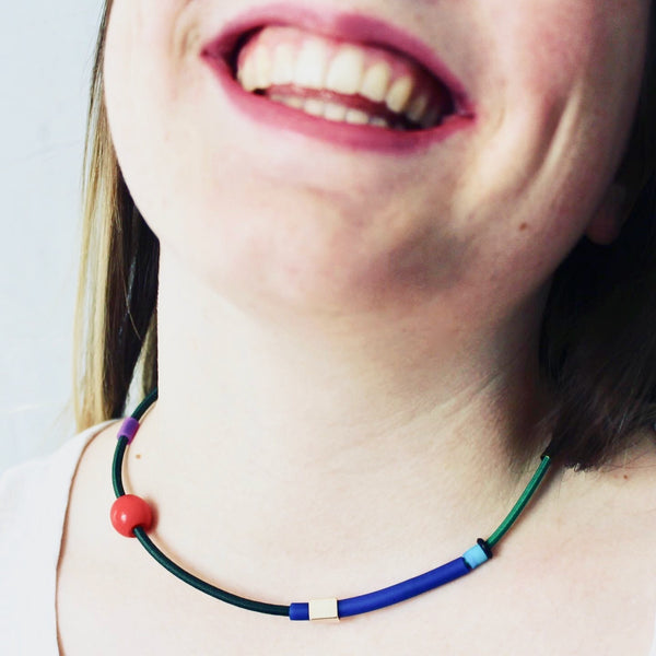 Isabelle wears Colour Collage choker in greens, royal+red.