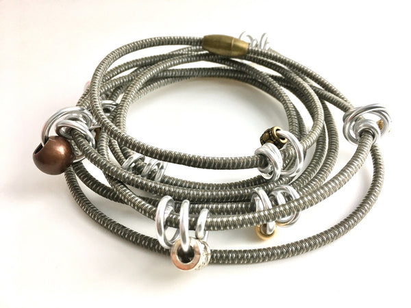 This is long Loopt necklace/bracelet in taupe with round silver wire.