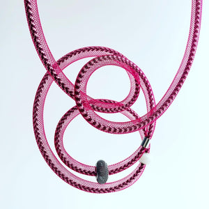 This Tubular is made with black/white shock cord and berry red netted tubing. it is 115cm