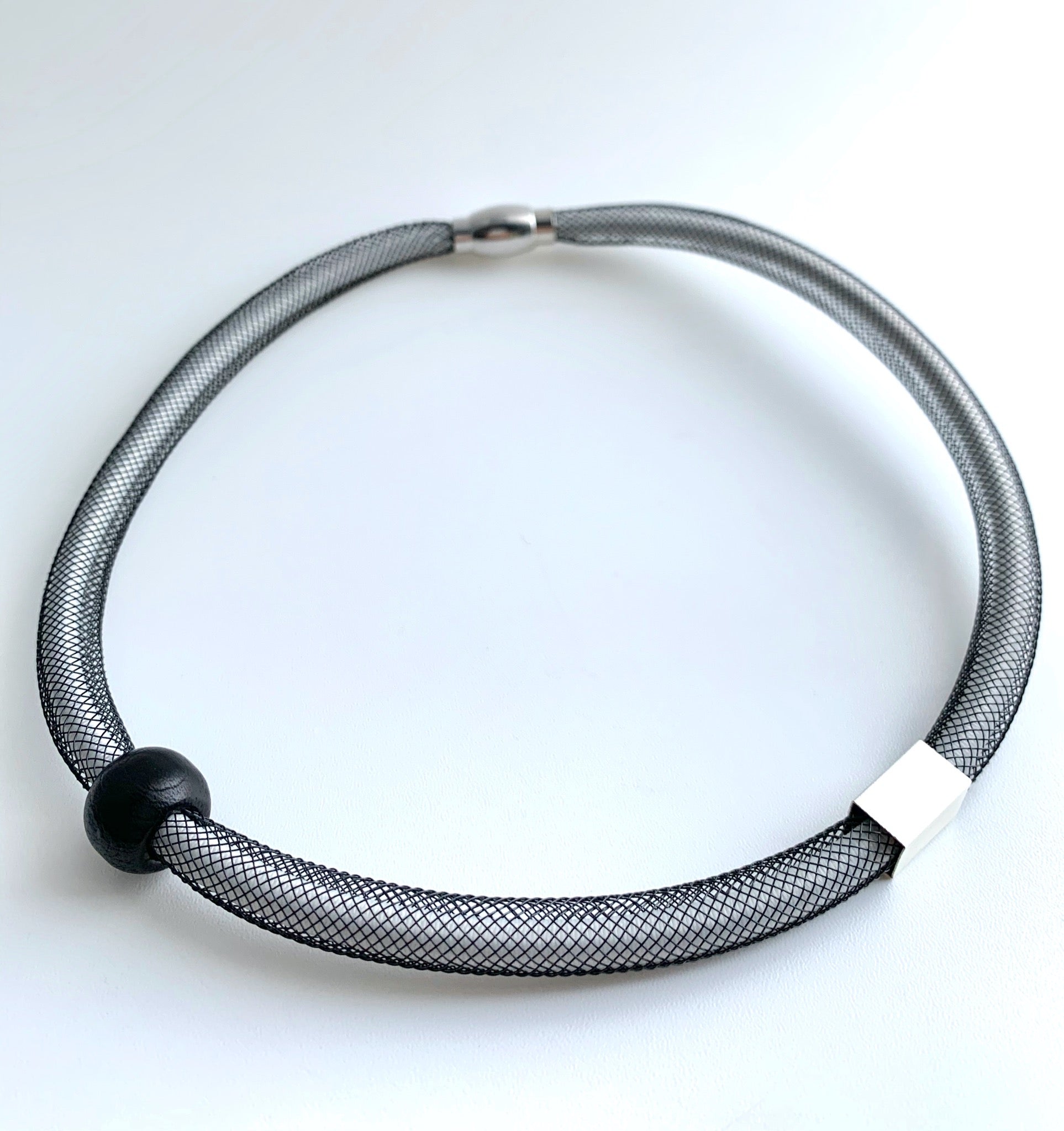This Short Tubular is made with white shock cord and black netted tubing. it is 43cm 