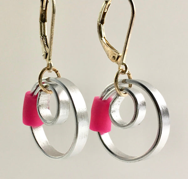 These Reel with a pink accent hang about 2cm.