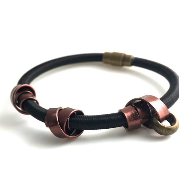 This a Loopt bracelet in heavy cord with bronze coloured aluminum wire and magnetic clasp.