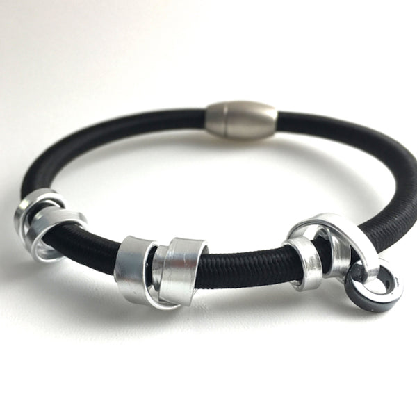 This is a Loopt bracelet on heavy cord and silver coloured aluminum wire.