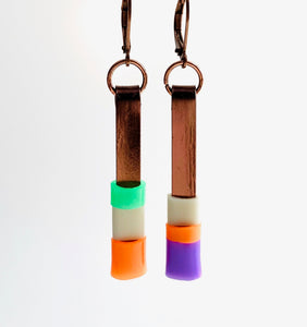 Matchstick earrings in bronze coloured aluminum wire with orange, purple, beige and green coloured silicone tubing. These hang 4cm in length.